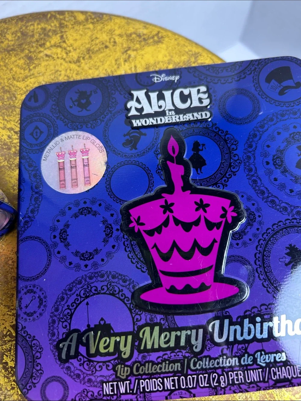 Disney Alice in Wonderland Lip Tin in Purple and Pink